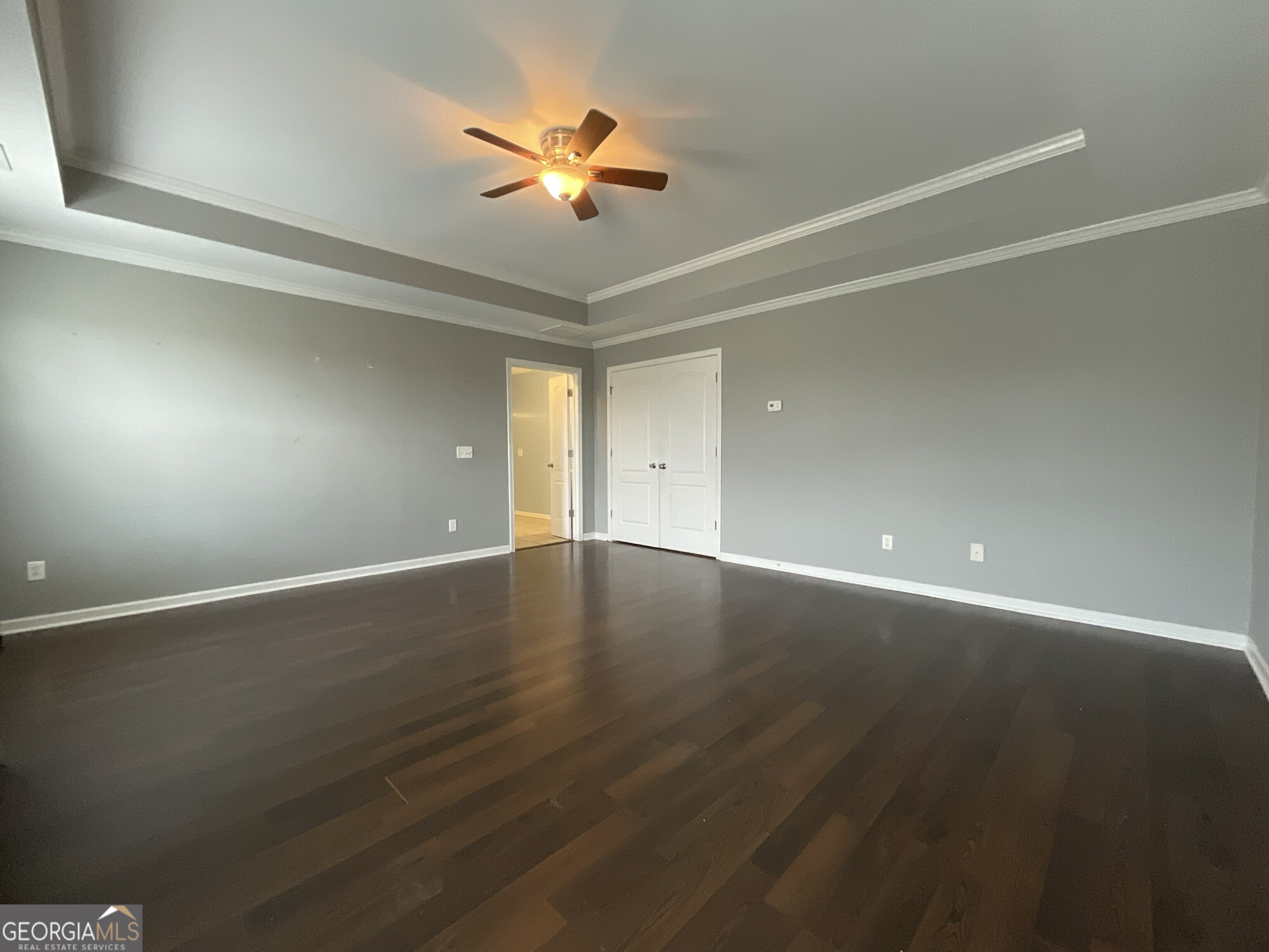 302 Brampton Way Perry, GA 31069 - Photo 25 of 39 an empty room with wooden floor and windows