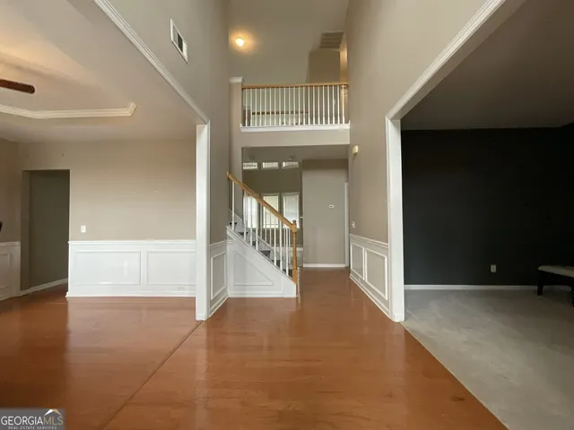 wooden floor in a hall with a window