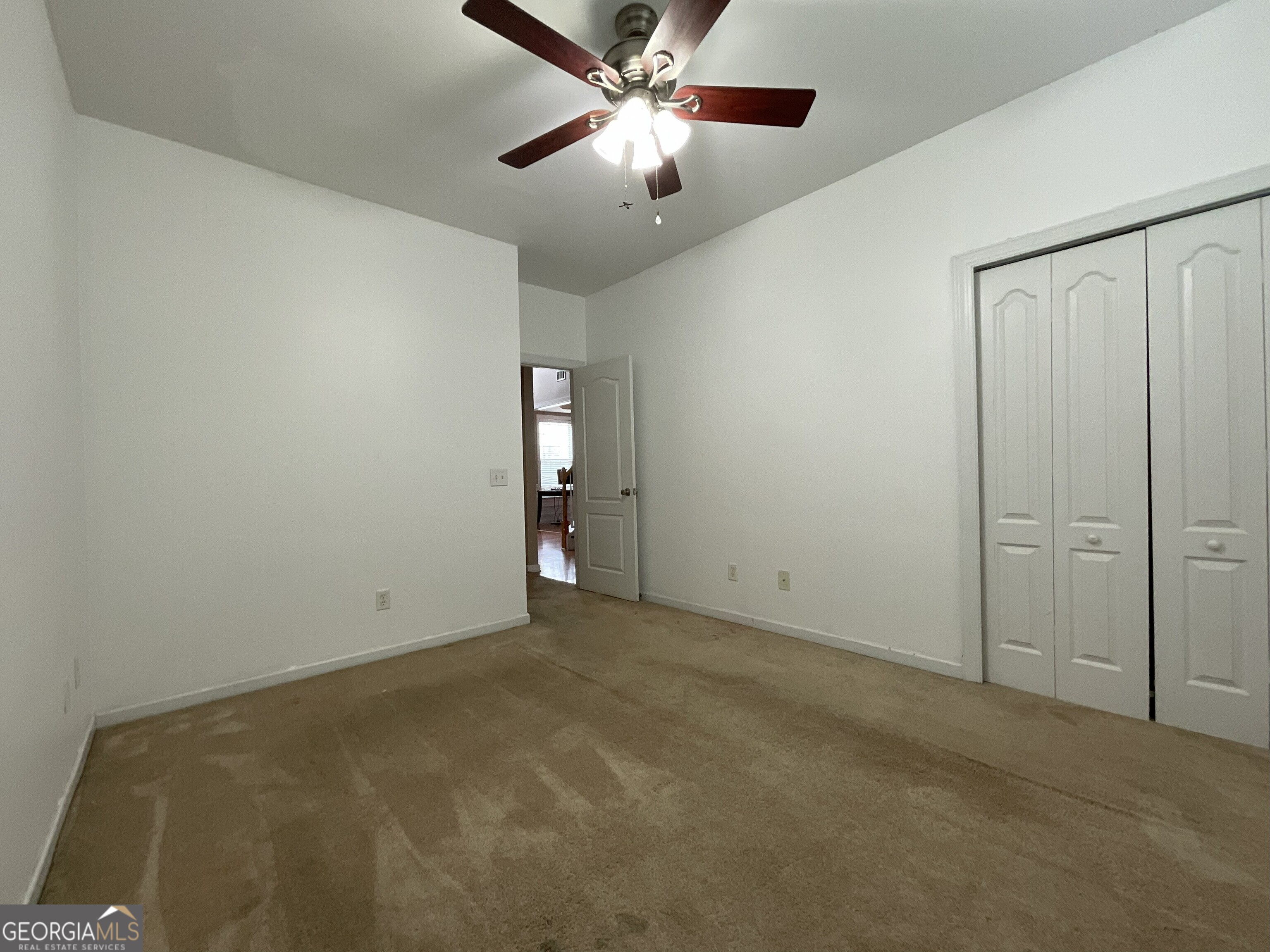 302 Brampton Way Perry, GA 31069 - Photo 10 of 39 an empty room with closet and windows