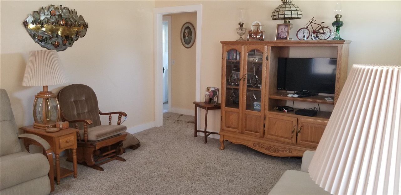 381 Aleut Street Biggs, CA 95917 - Photo 11 of 35 a living room with furniture and a flat screen tv