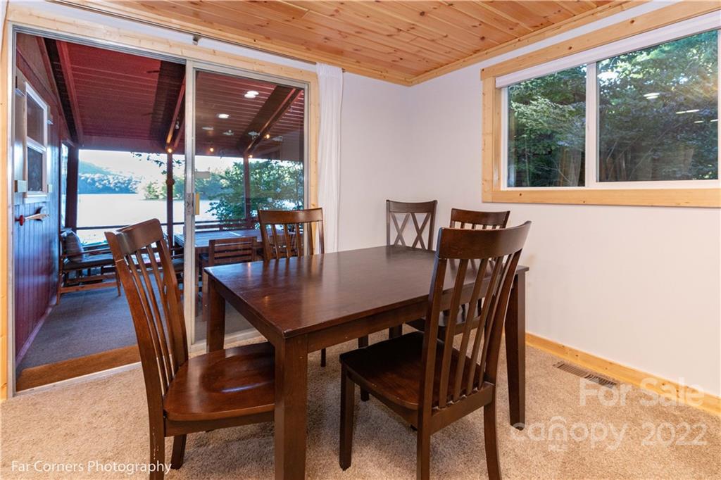 588 Thunderbird Trail Robbinsville, NC 28771 - Photo 13 of 20 a view of a dining room with furniture window and outside view