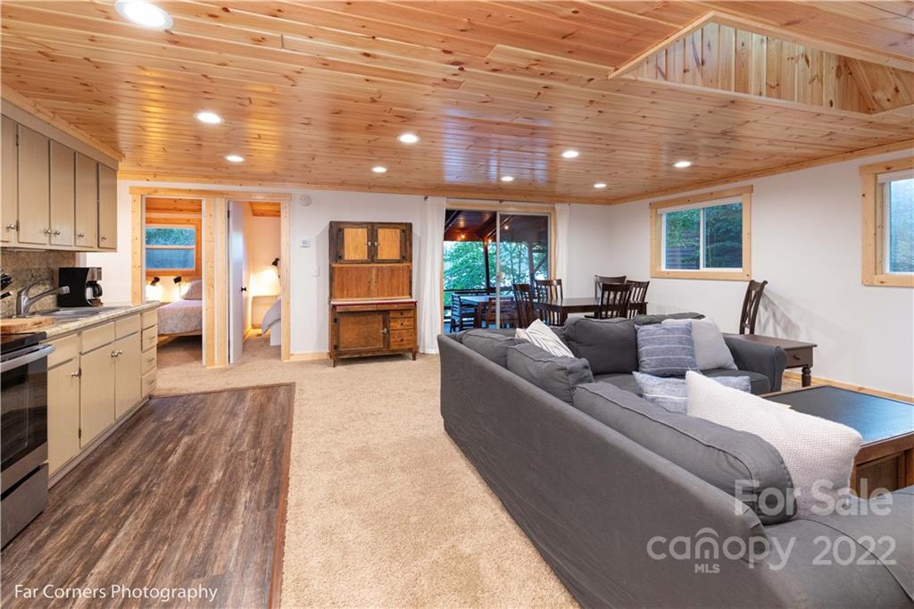 588 Thunderbird Trail Robbinsville, NC 28771 - Photo 8 of 20 a living room with furniture and a kitchen
