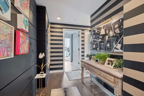 a view of an entryway with wooden floor and stairs