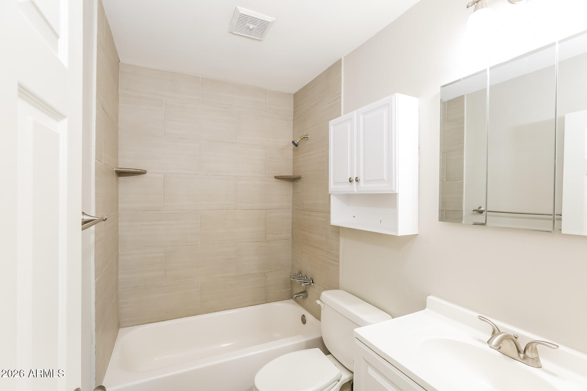 1323 West Romo Jones Street Tempe, AZ 85281 - Photo 13 of 16 a bathroom with a toilet a sink and bathtub