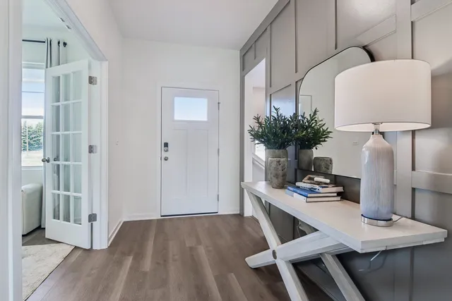 a view of kitchen with cabinets and wooden floor