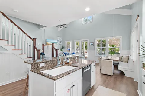 a kitchen with stainless steel appliances granite countertop a sink stove and a refrigerator