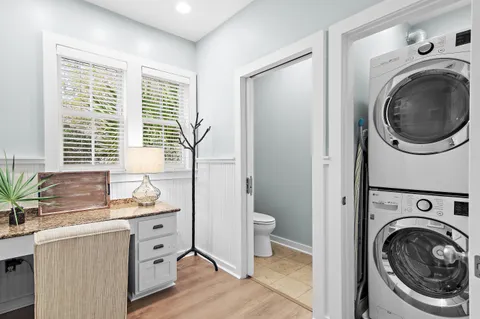 a view of a bedroom with washer and dryer
