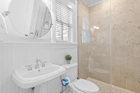 a bathroom with a sink and a shower curtain