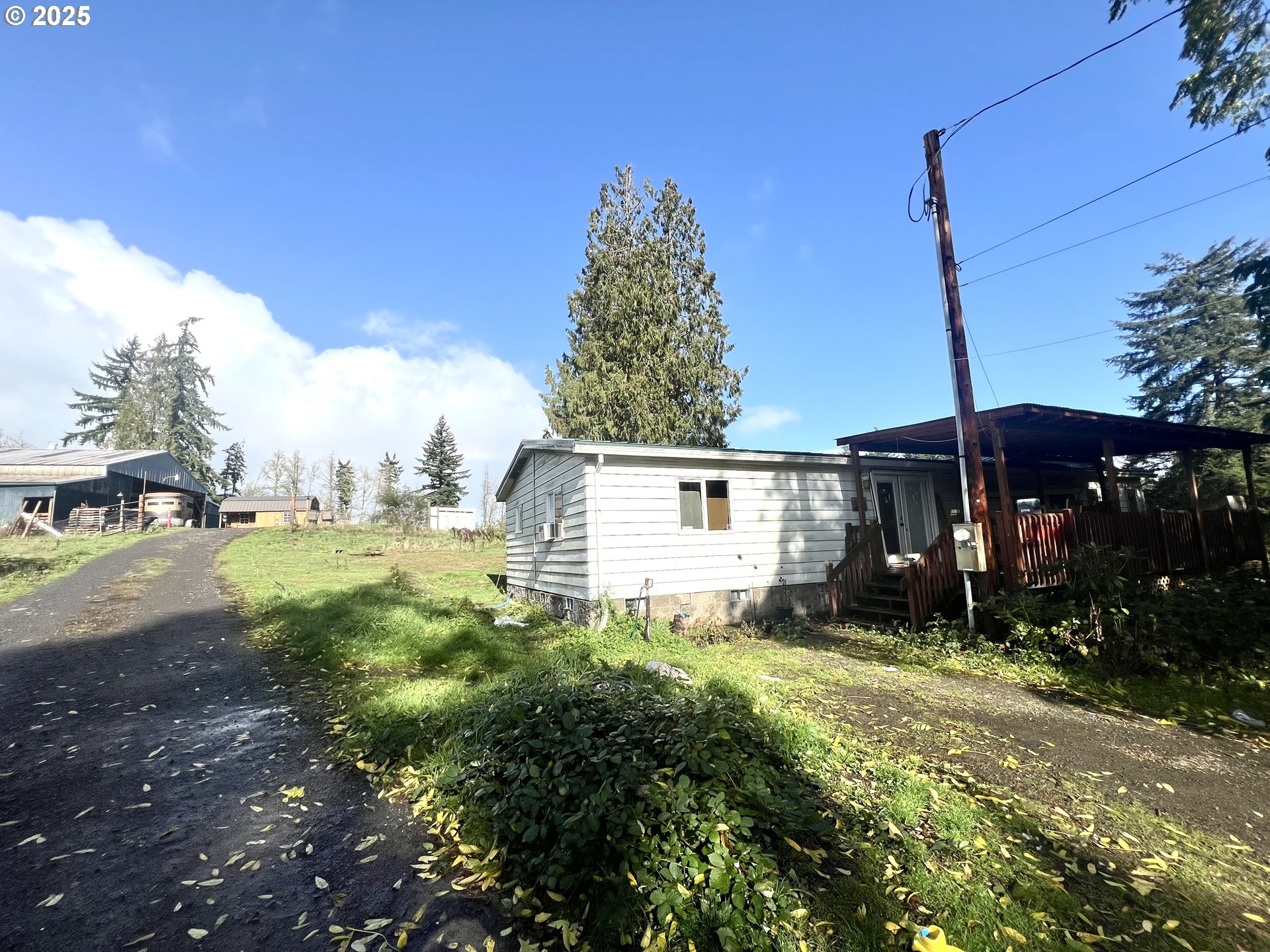 24853 Warren Road Rainier, OR 97048 - Photo 14 of 27 a view of a house with a yard
