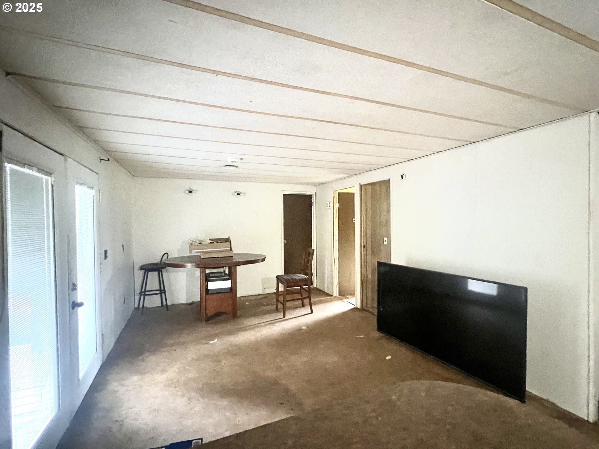24853 Warren Road Rainier, OR 97048 - Photo 15 of 27 a living room with furniture and a flat screen tv