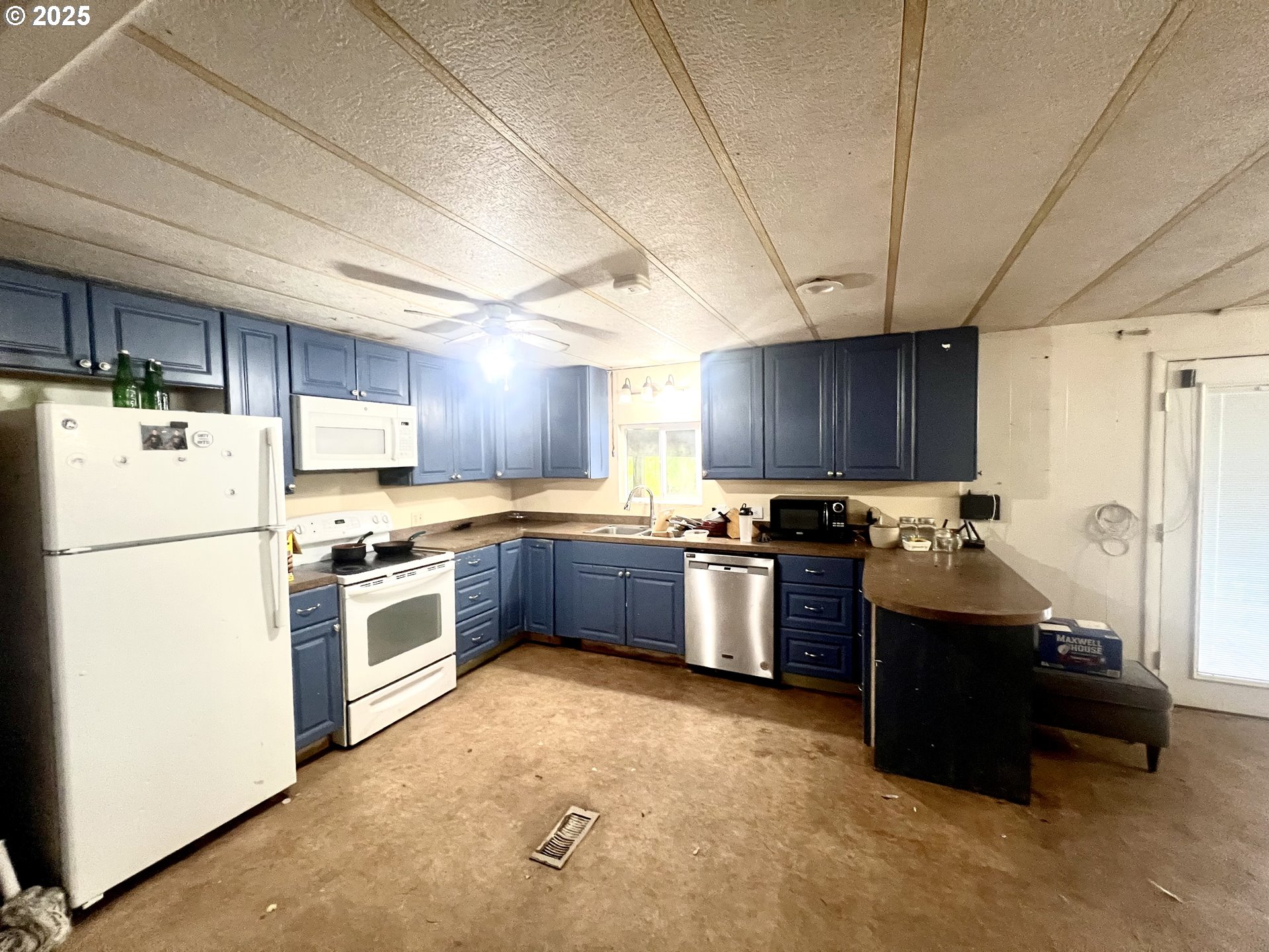 24853 Warren Road Rainier, OR 97048 - Photo 17 of 27 a kitchen with a refrigerator and a stove