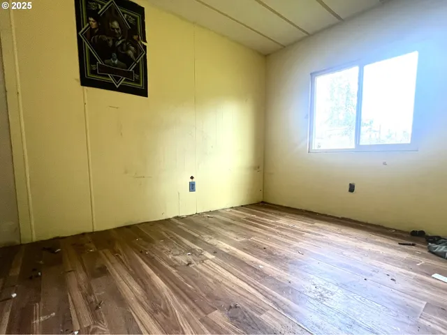a living room with furniture and a mirror