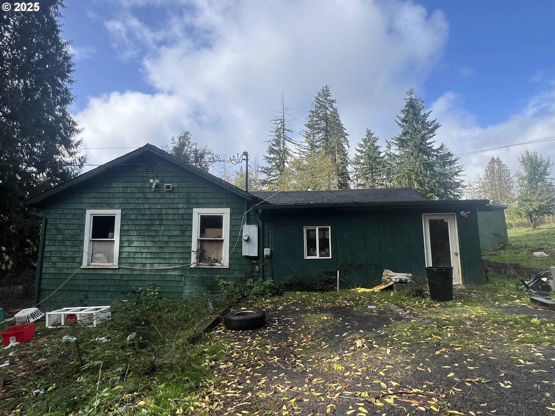 24853 Warren Road Rainier, OR 97048 - Photo 27 of 27 a backyard of a house with plants and trees