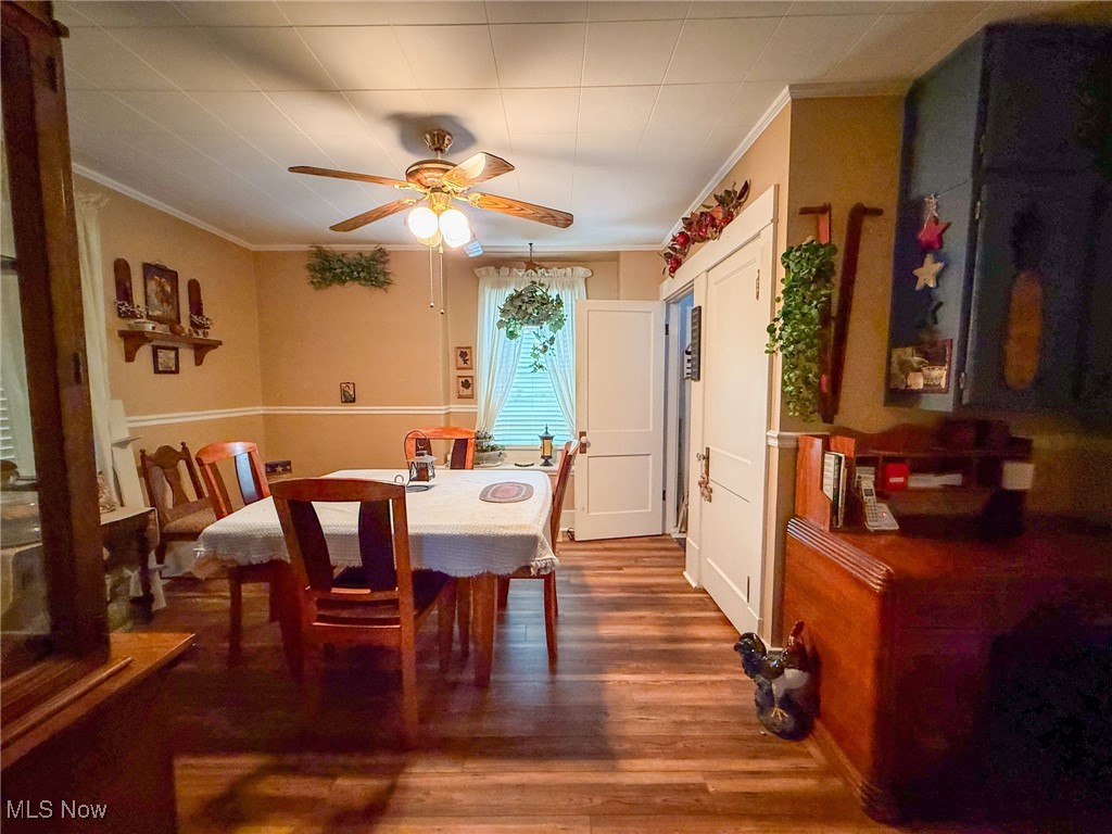 1667 County Road Dillonvale, OH 43917 - Photo 19 of 35 Dining area with ornamental molding, wood finished floors, and ceiling fan