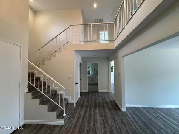 a view of entryway with wooden floor
