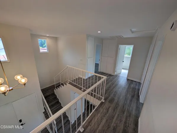 a view of an entryway with wooden floor