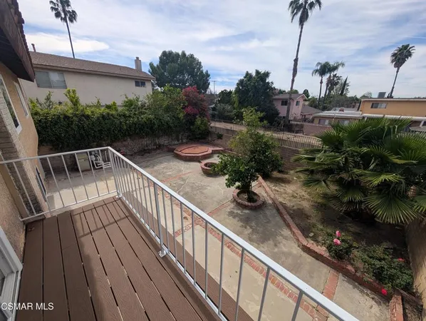 a view of balcony with furniture