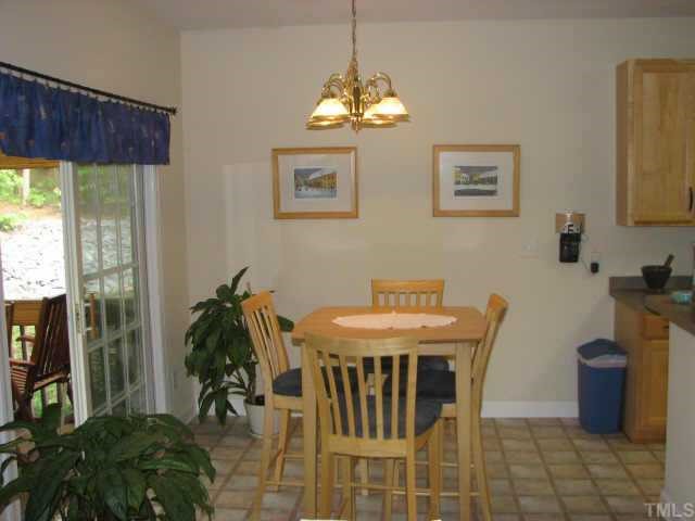 2604 Buck Spring Court Raleigh, NC 27603 - Photo 7 of 12 Breakfast area, over looks the screened in porch with easy access to the kitchen.