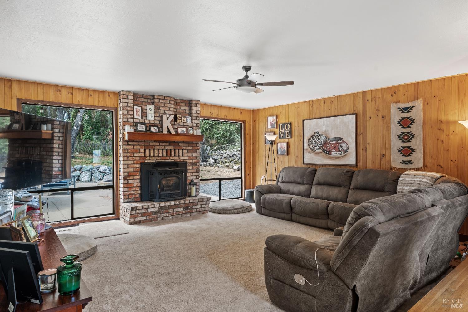 9510 West Potter Valley Road Potter Valley, CA 95469 - Photo 1 of 30 a living room with furniture a flat screen tv and a fireplace