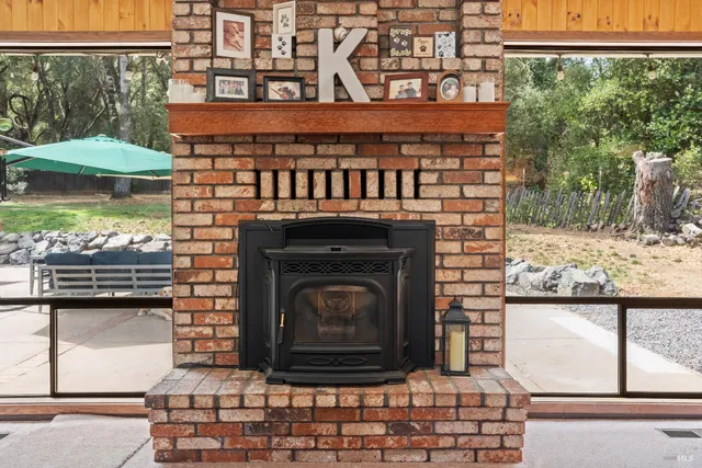 a living room with furniture a flat screen tv and gym equipment