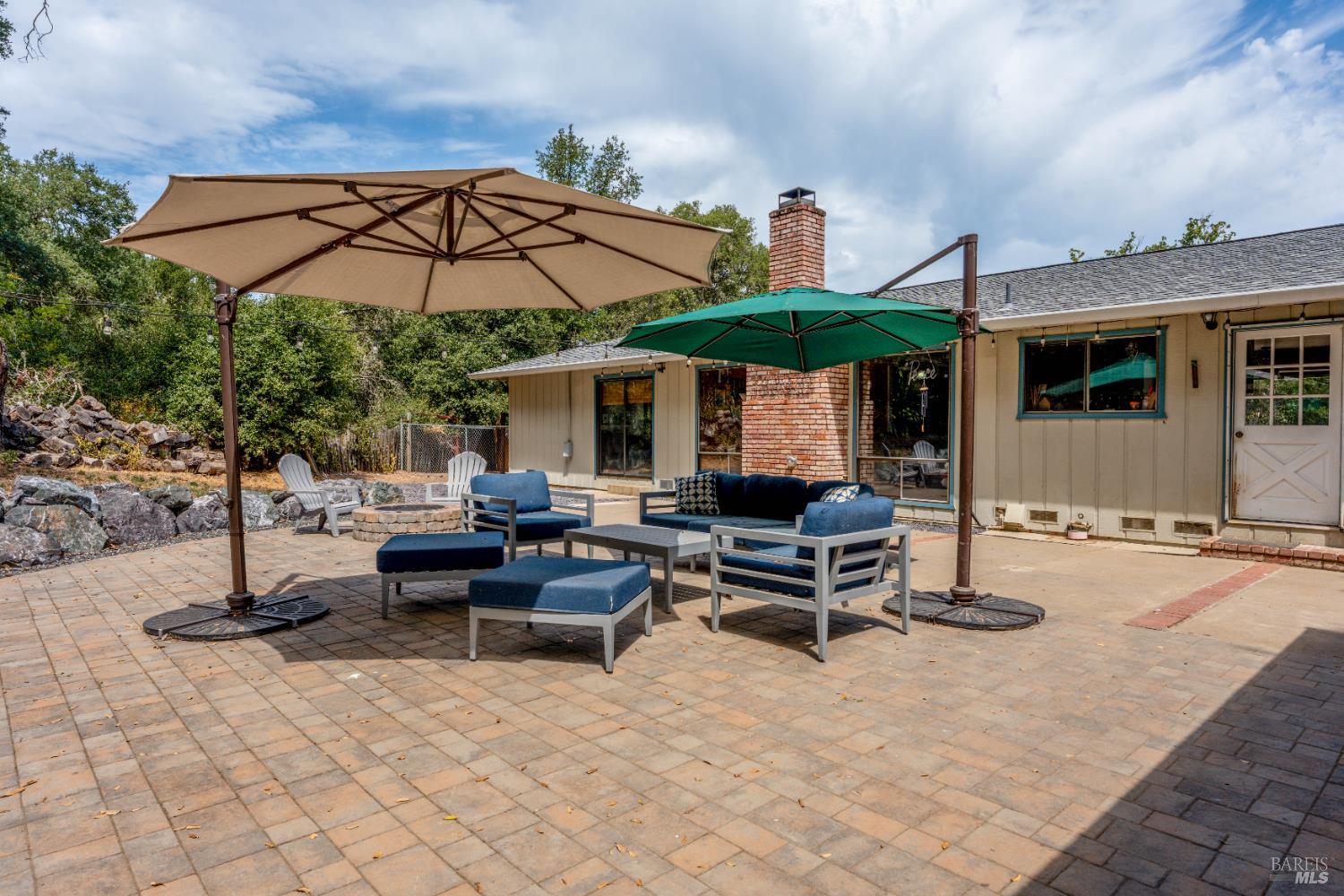 9510 West Potter Valley Road Potter Valley, CA 95469 - Photo 18 of 30 a backyard of a house with table and chairs