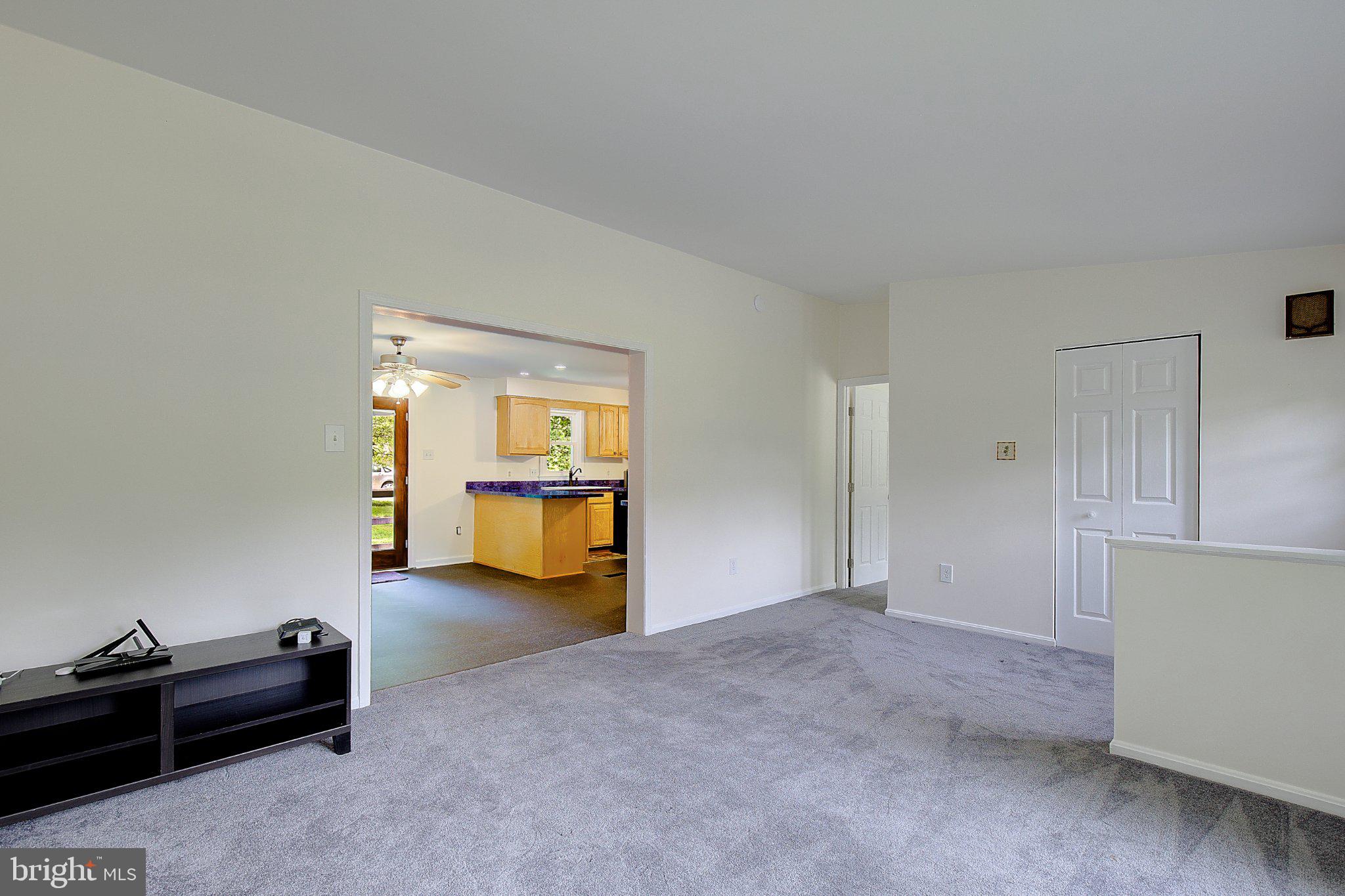1111 Redeye Road Lusby, MD 20657 - Photo 10 of 24 Spacious living area with natural light.
