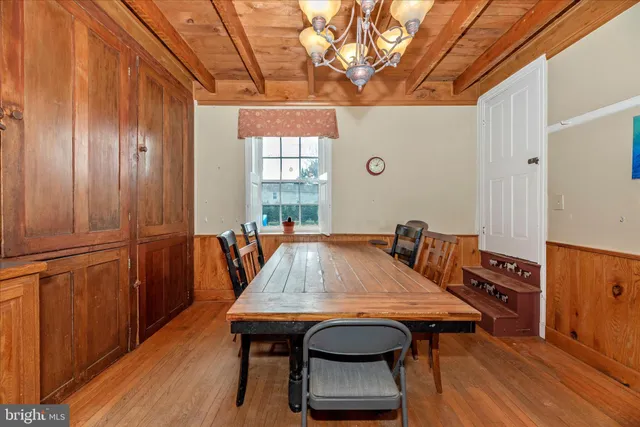 a kitchen with stainless steel appliances granite countertop a stove and a wooden floors