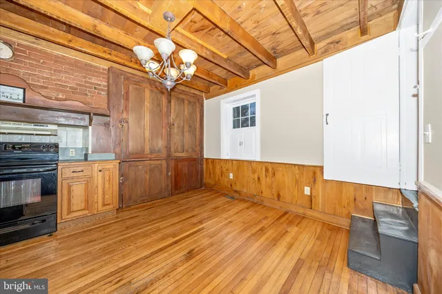 a kitchen with stainless steel appliances granite countertop a stove and a microwave