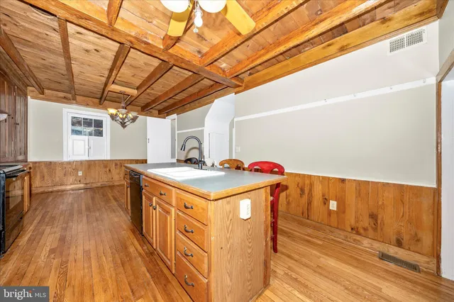a bathroom with a sink a vanity and a mirror