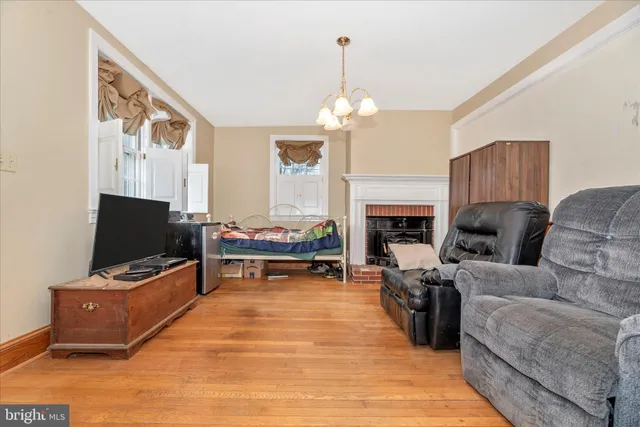 a view of a livingroom with furniture and a window