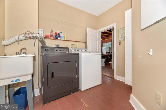 a view of a livingroom with furniture and a window