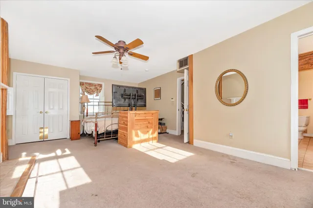 a bathroom with a toilet and a bathtub