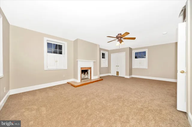 a room with a wooden floor and a table