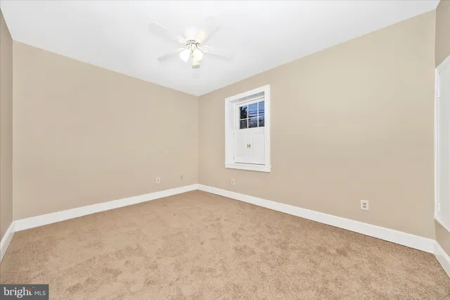 a view of a house with snow on the road