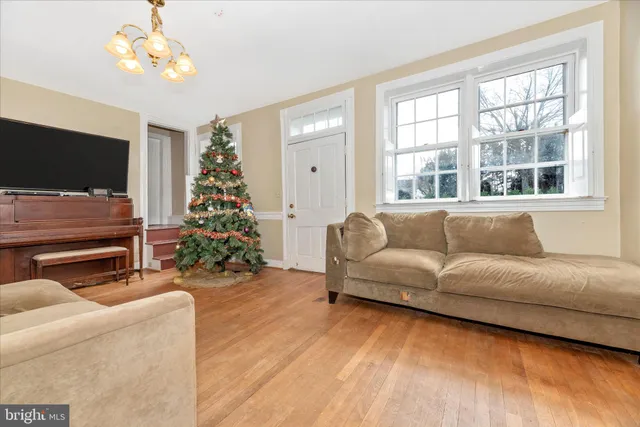 a living room with furniture or flat screen tv and a window