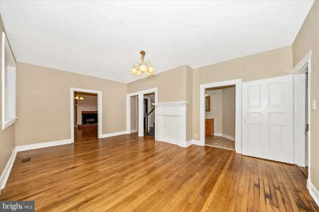 a view of a room with wooden floor and stairs