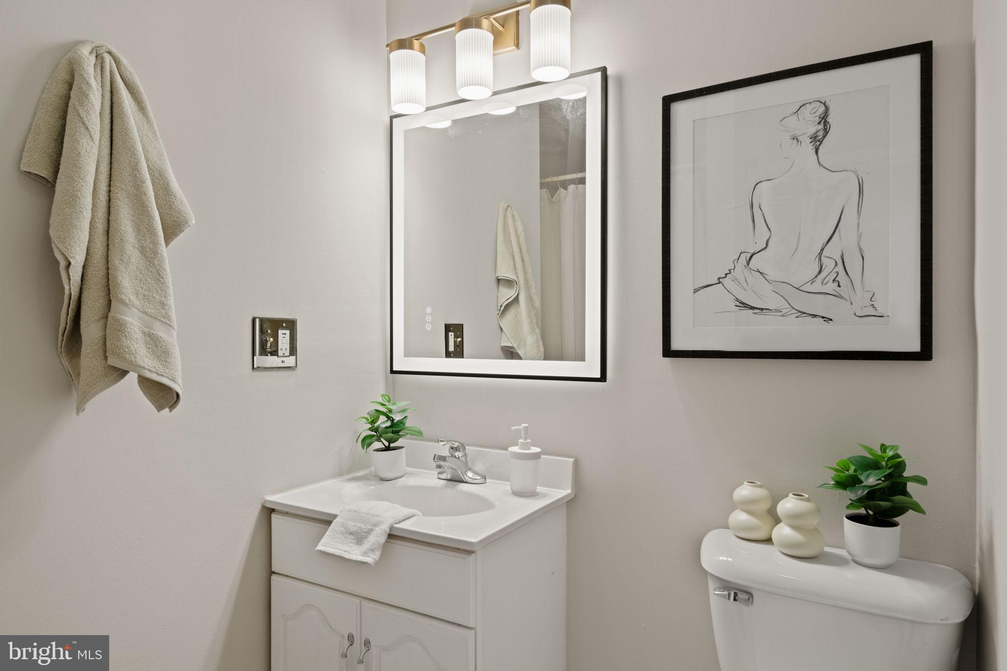 4092 Pechin Street Philadelphia, PA 19128 - Photo 17 of 28 a bathroom with a sink mirror and vanity