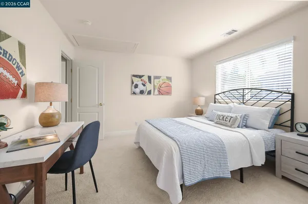a bedroom with a bed and a table