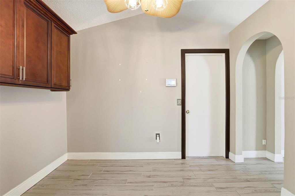 10517 Rocking A Run Orlando, FL 32825 - Photo 17 of 29 a view of an empty room with wooden floor and a window