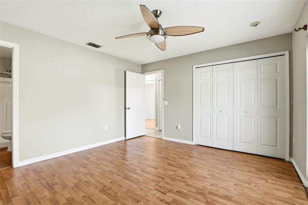 10517 Rocking A Run Orlando, FL 32825 - Photo 19 of 29 a view of room with wooden floor and ceiling fan
