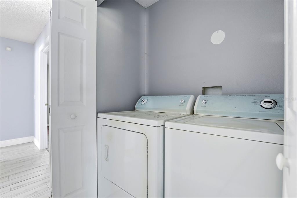 10517 Rocking A Run Orlando, FL 32825 - Photo 26 of 29 a utility room with dryer and washer