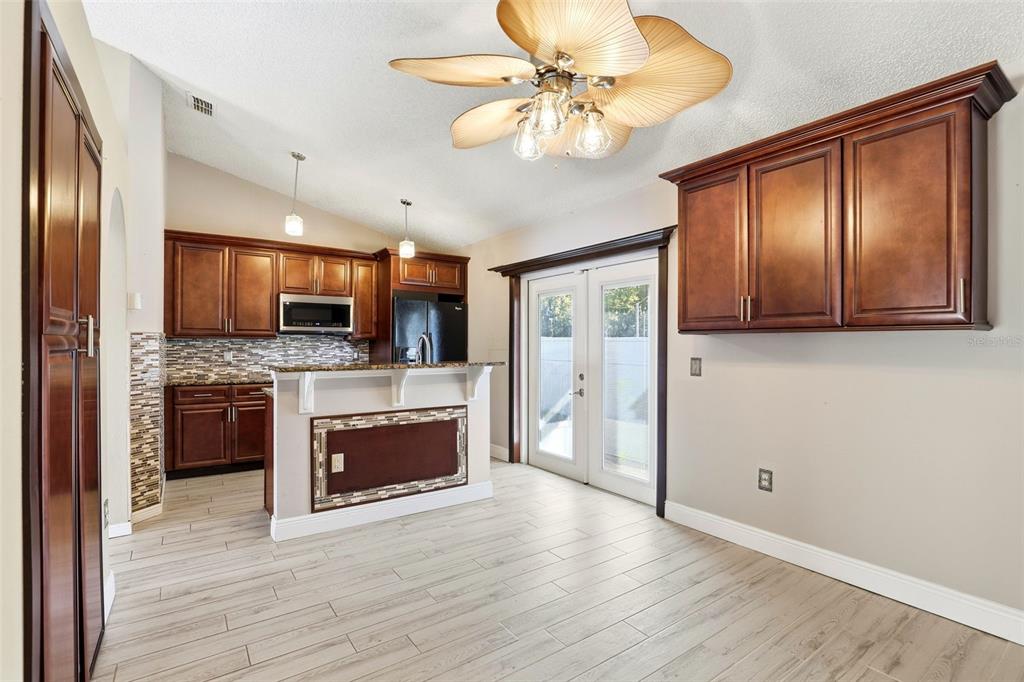 10517 Rocking A Run Orlando, FL 32825 - Photo 4 of 29 a view of kitchen with sink microwave and refrigerator