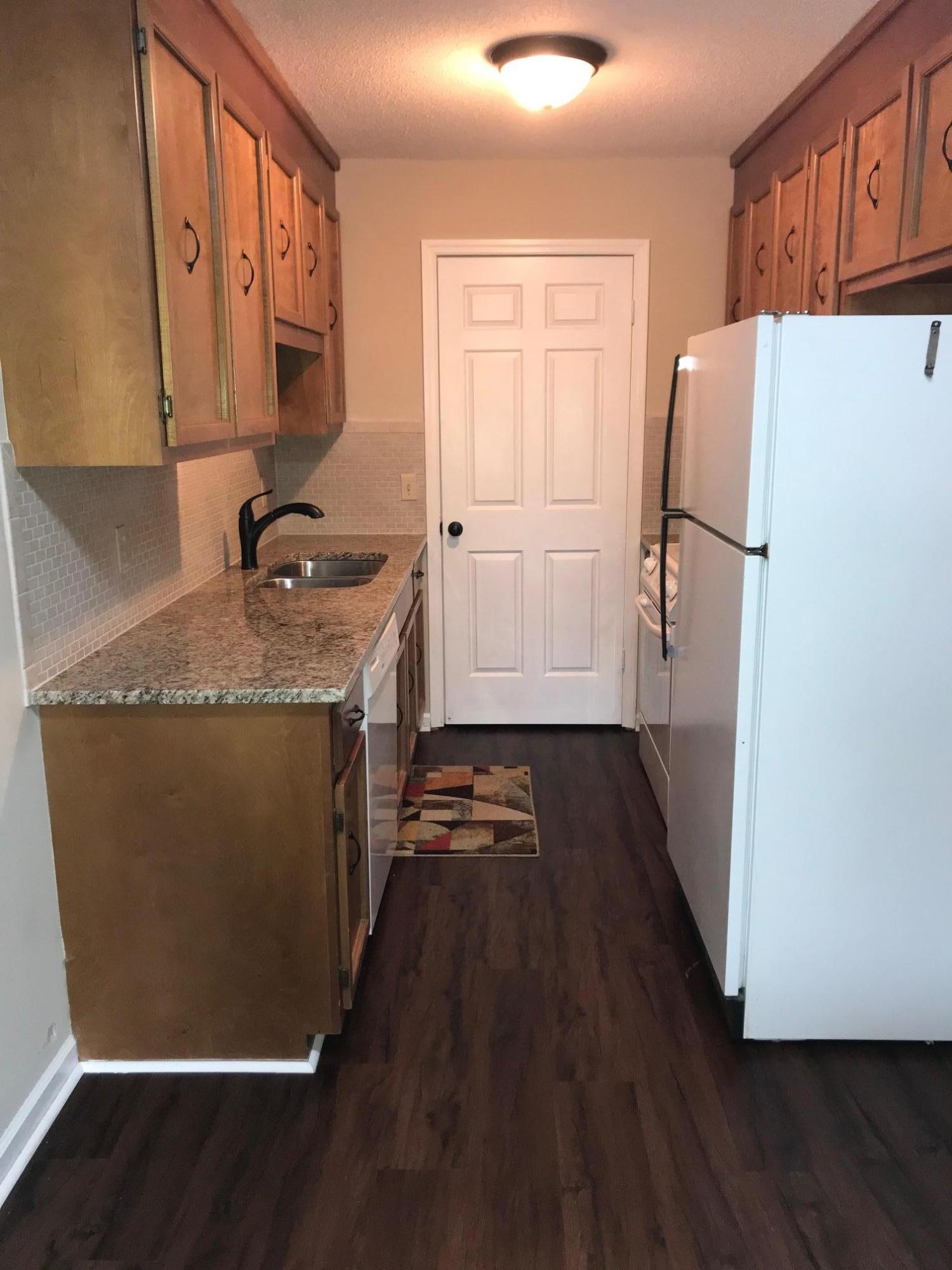 630 Monte Vista Road, Unit 502 Union Hall, VA 24176 - Photo 11 of 33 a kitchen with granite countertop a refrigerator a sink and dishwasher