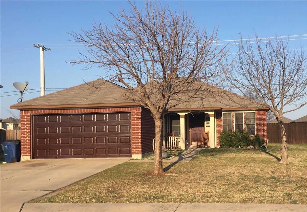 806 Red River Lane Leander, TX 78641 - Photo 1 of 1 a front view of a house with a yard and garage