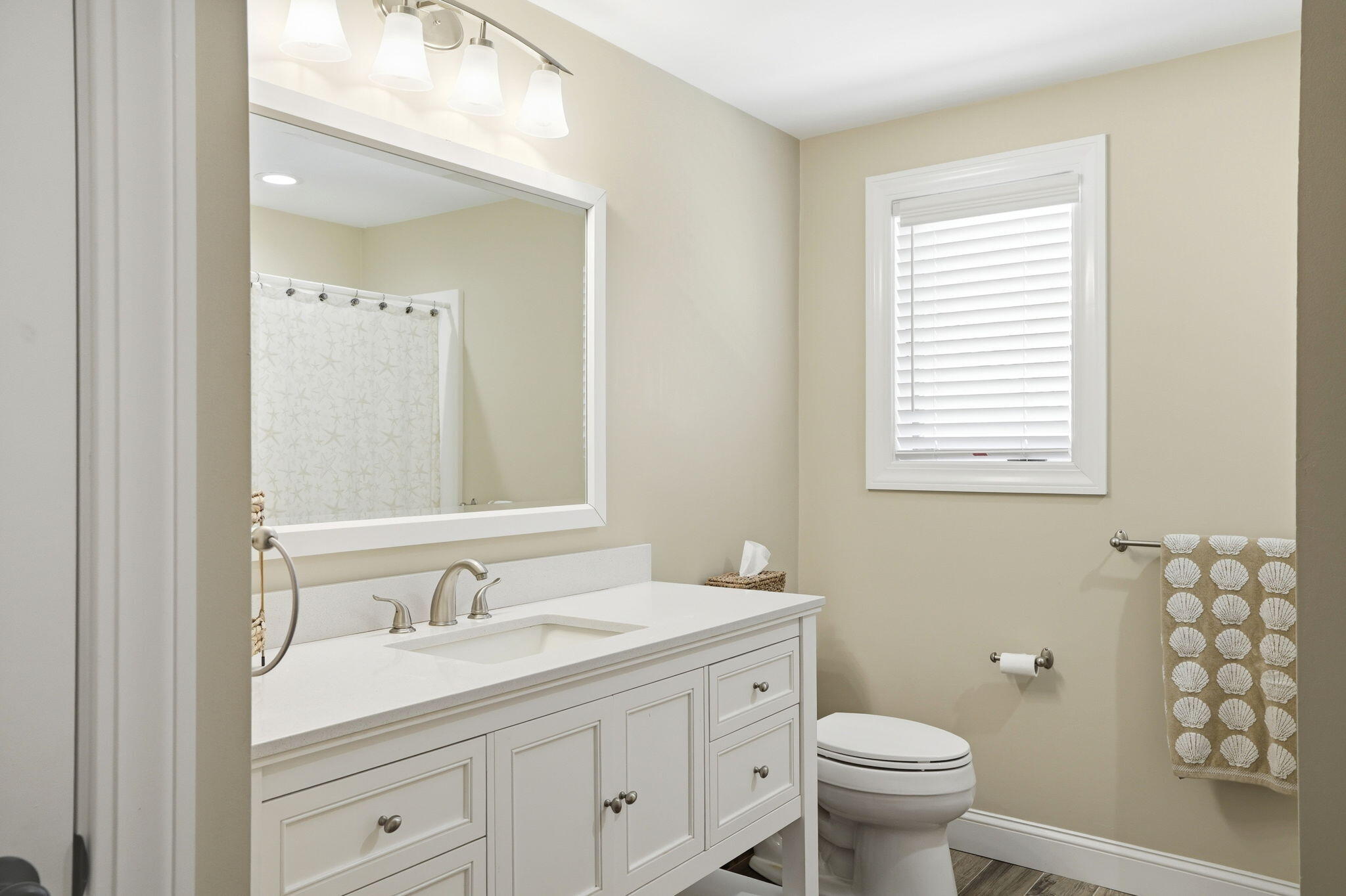4 Cross Road Bourne, MA 02532 - Photo 20 of 47 a bathroom with a granite countertop sink toilet a large mirror and shower