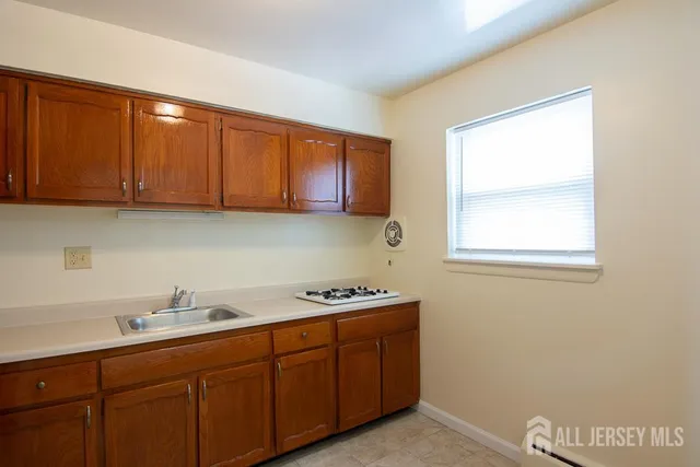 a kitchen with a sink and cabinets