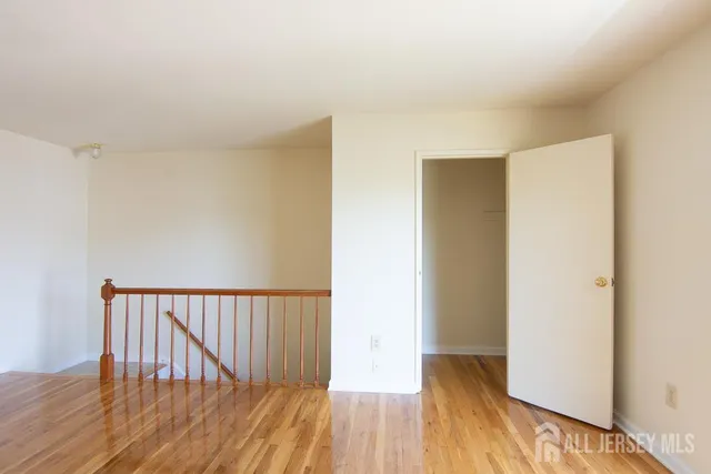 a view of hallway with wooden floor