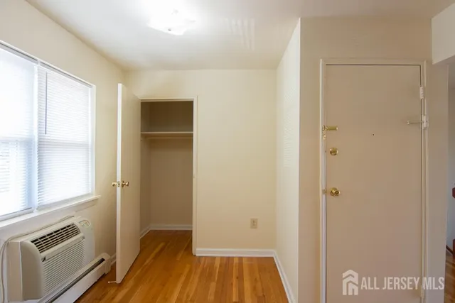 a view of a kitchen from a hallway
