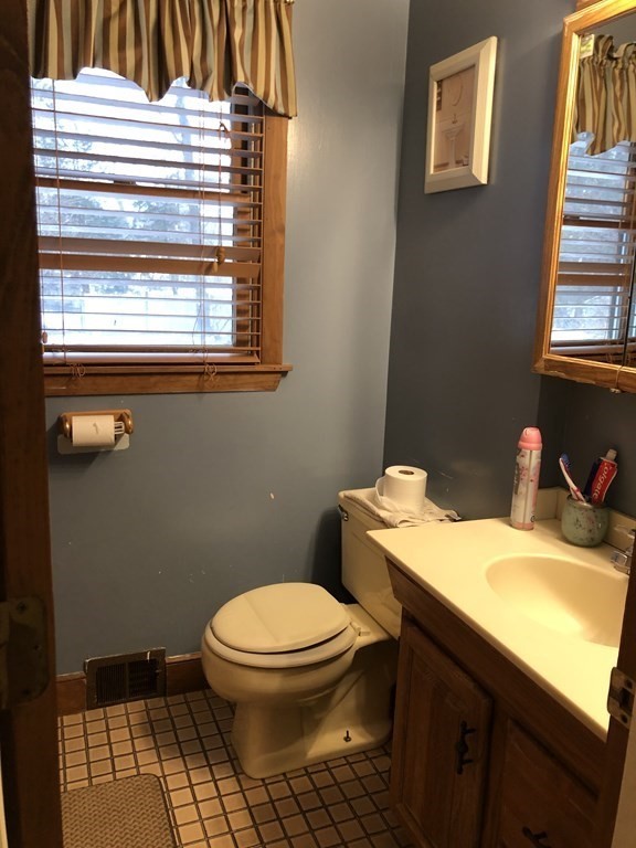 15 Williams Road Ashland, MA 01721 - Photo 14 of 26 a bathroom with a sink a toilet and a window