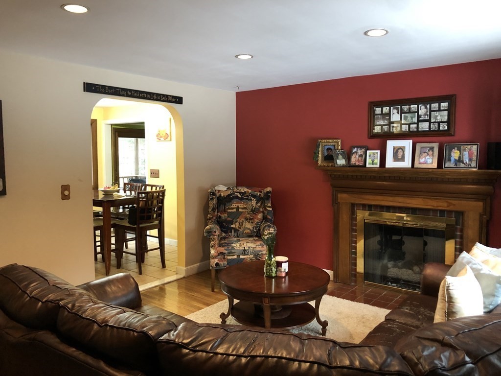 15 Williams Road Ashland, MA 01721 - Photo 3 of 26 a living room with furniture and a fireplace